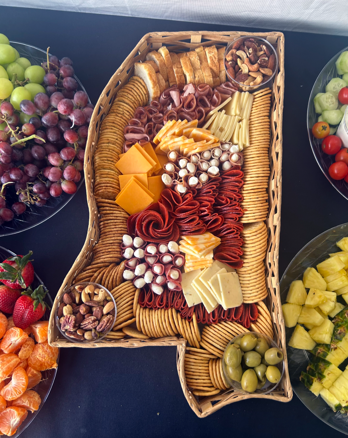 Catering tray shaped like the state of Mississippi, filled with meats, cheeses and crackers