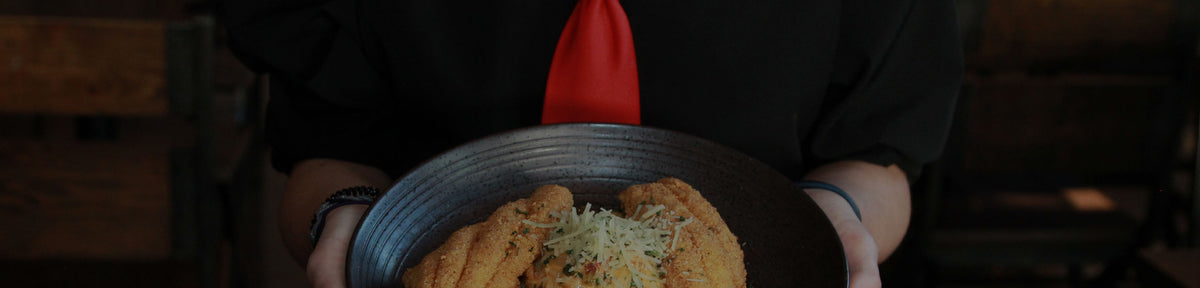 A Georgia Blue server holding a plate