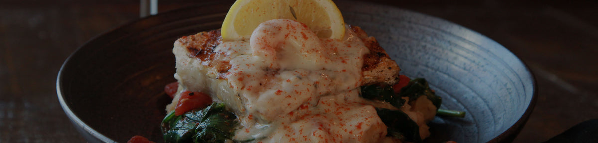 A Georgia Blue fish entrée with a lemon wedge